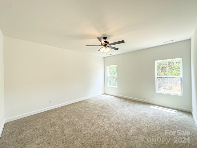 unfurnished room featuring carpet floors and ceiling fan