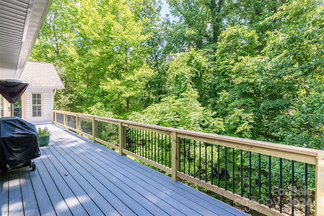 wooden deck featuring area for grilling