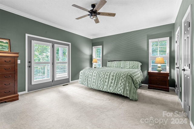 bedroom with ceiling fan, light colored carpet, access to exterior, and multiple windows