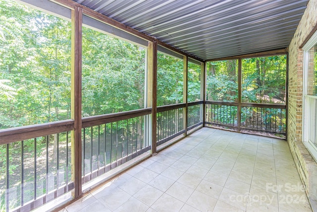 unfurnished sunroom with a wealth of natural light