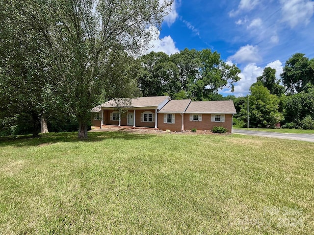 single story home featuring a front yard and a porch