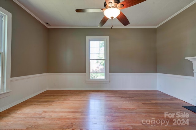 spare room with ceiling fan, light hardwood / wood-style flooring, and ornamental molding