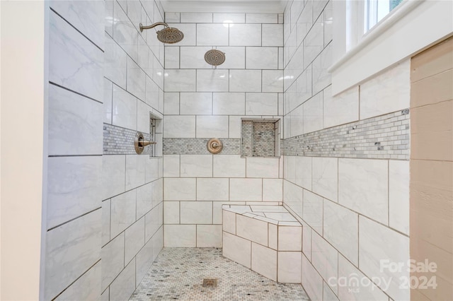 bathroom with a tile shower