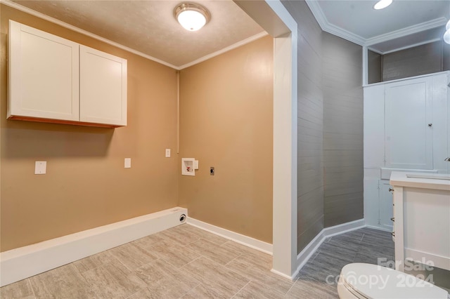 laundry room featuring crown molding, hookup for a washing machine, and hookup for an electric dryer