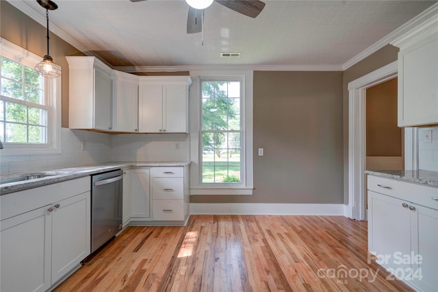 kitchen featuring stainless steel dishwasher and white cabinets