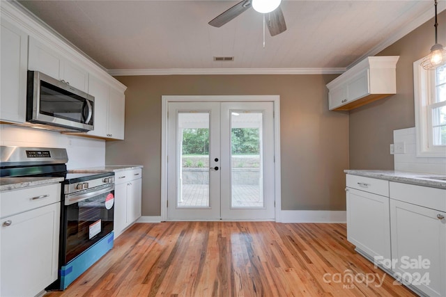 kitchen featuring appliances with stainless steel finishes, crown molding, backsplash, and white cabinets