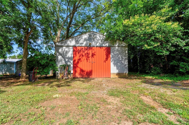 view of outbuilding with a lawn