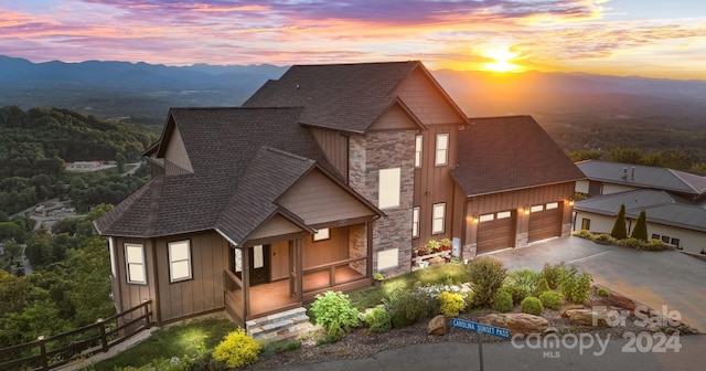 view of front of property with a mountain view and a porch