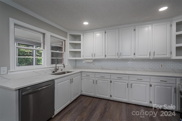 kitchen featuring dishwasher, a textured ceiling, white cabinets, and sink