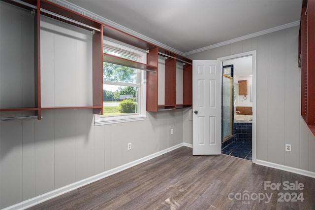 interior space with dark hardwood / wood-style floors and crown molding