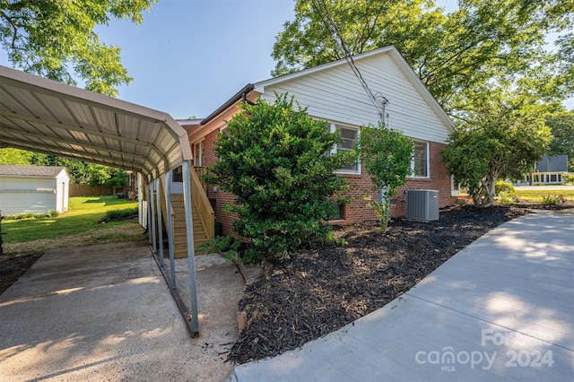 view of home's exterior featuring a carport and central AC unit