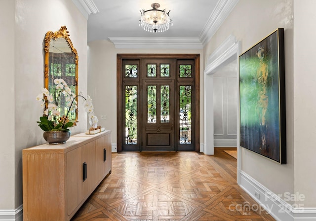 entryway with light parquet flooring, crown molding, and a notable chandelier