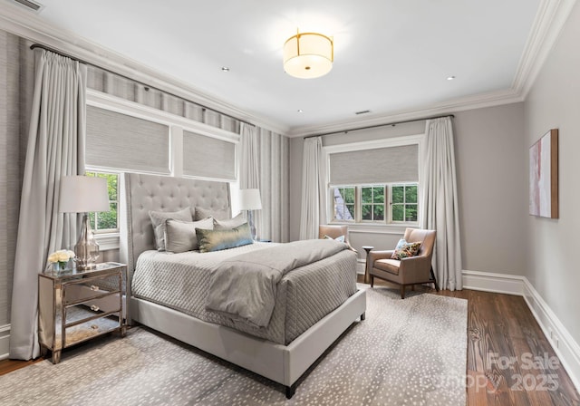 bedroom with hardwood / wood-style flooring and crown molding