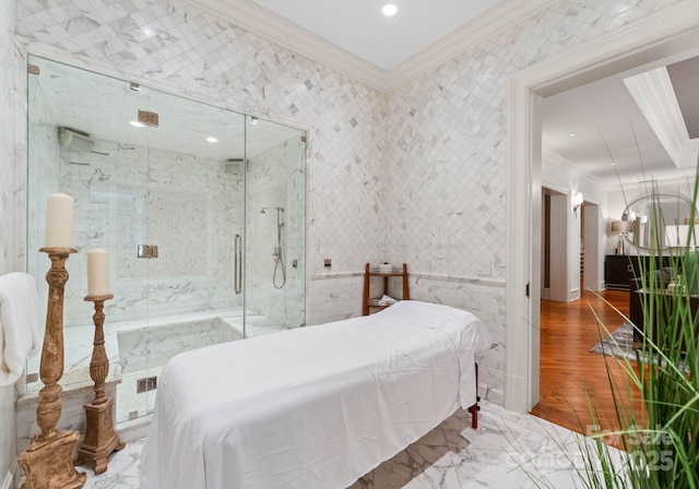 bedroom with ornamental molding and tile walls