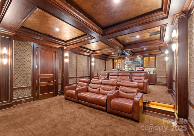 carpeted cinema featuring beamed ceiling, bar area, crown molding, and coffered ceiling