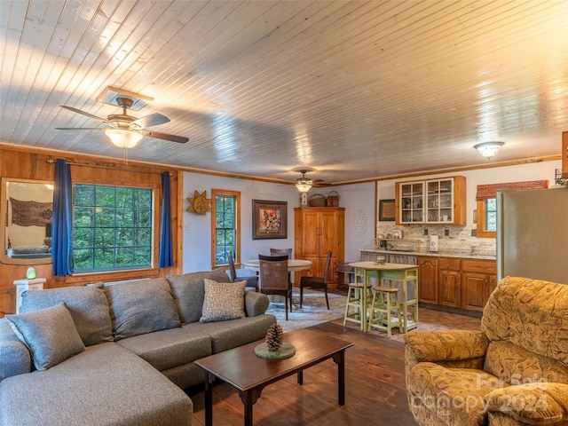 living room featuring ceiling fan, wooden ceiling, wood-type flooring, and crown molding