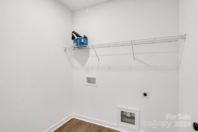 clothes washing area featuring wood-type flooring, hookup for a washing machine, and electric dryer hookup