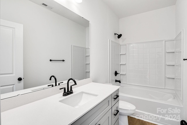 full bathroom featuring hardwood / wood-style flooring, shower / bath combination, toilet, and vanity