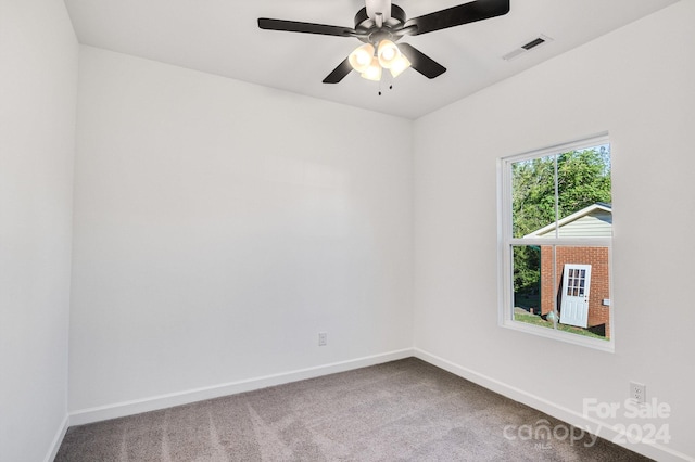 empty room with carpet floors and ceiling fan