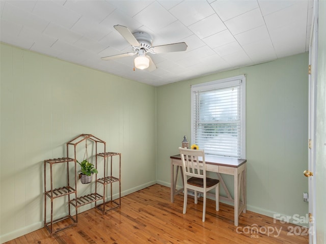 home office featuring wood-type flooring and ceiling fan