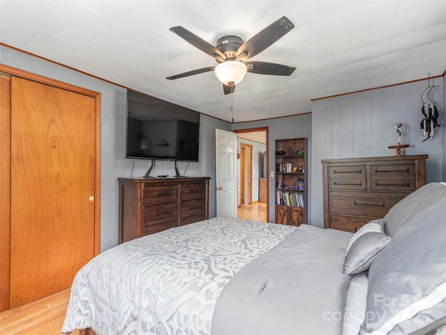 bedroom featuring hardwood / wood-style flooring and ceiling fan