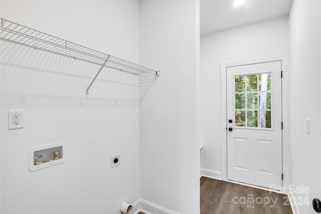 clothes washing area with hookup for a washing machine, dark wood-type flooring, and hookup for an electric dryer