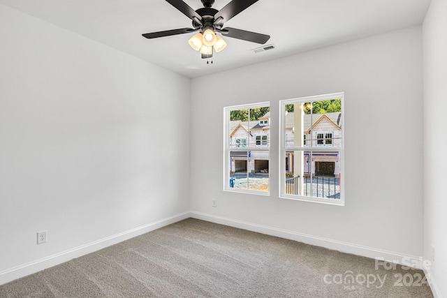 unfurnished room featuring carpet flooring and ceiling fan