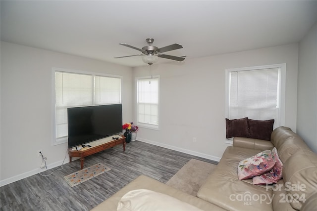 living room featuring ceiling fan and hardwood / wood-style floors