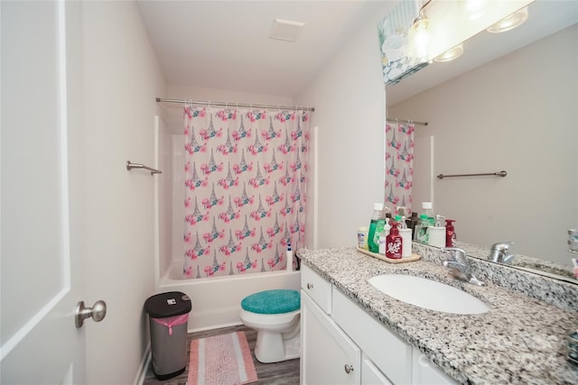 full bathroom with wood-type flooring, toilet, vanity, and shower / tub combo with curtain