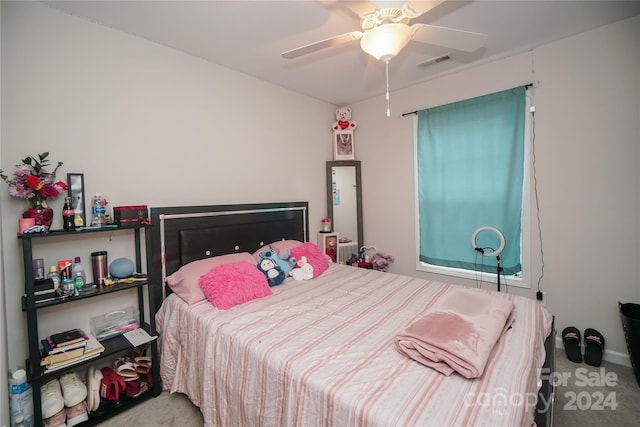 carpeted bedroom with ceiling fan