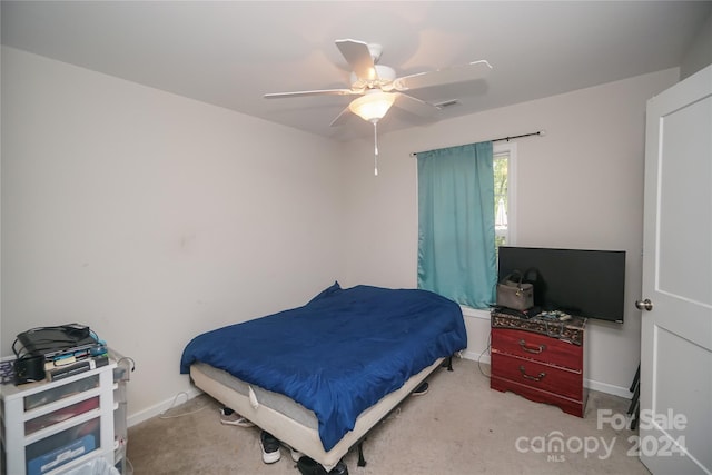 carpeted bedroom featuring ceiling fan