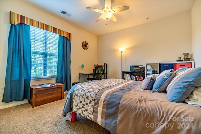 carpeted bedroom with ceiling fan