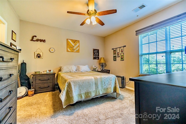 bedroom featuring ceiling fan and carpet floors