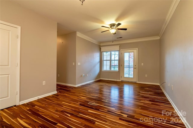 spare room with ceiling fan, crown molding, and dark hardwood / wood-style floors