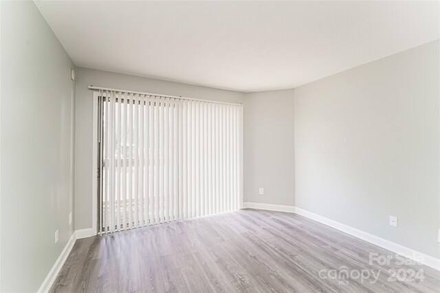 empty room featuring hardwood / wood-style flooring