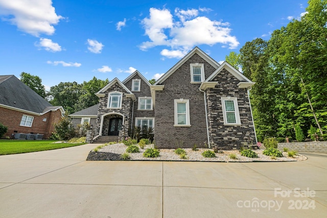 view of front of property with central AC unit