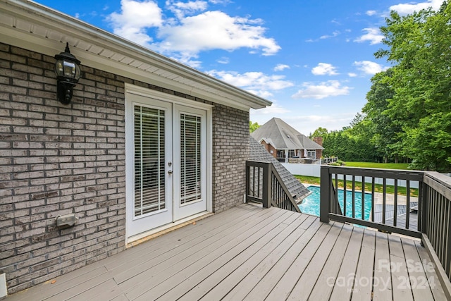 wooden terrace featuring french doors