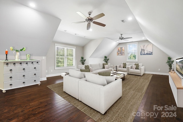 living room with dark wood-type flooring and lofted ceiling