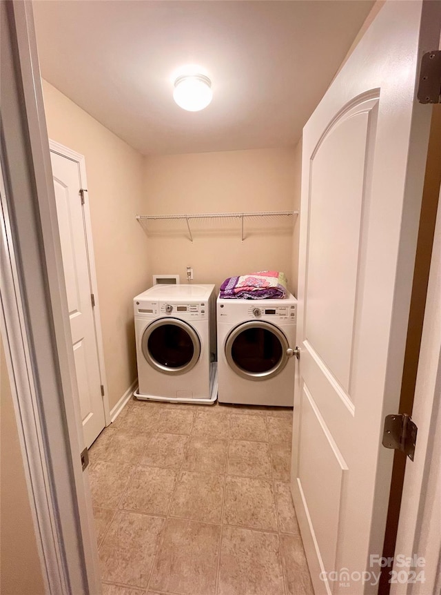 clothes washing area featuring washing machine and dryer