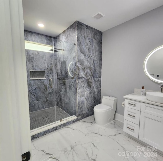 bathroom with vanity, toilet, and walk in shower