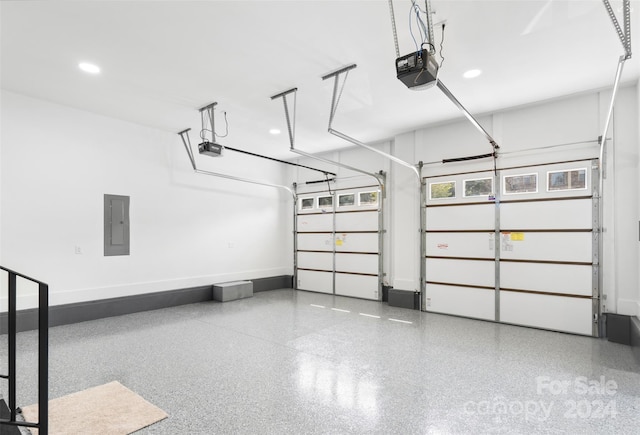 garage featuring a garage door opener and electric panel