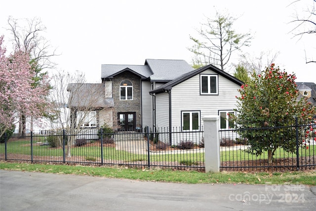 front facade with a front lawn