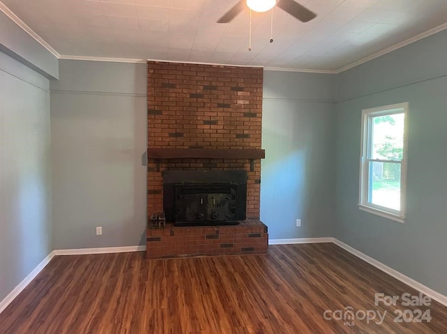 unfurnished living room featuring a fireplace, crown molding, and dark hardwood / wood-style flooring