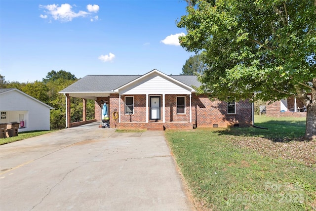 bungalow-style house with a front lawn, a carport, and covered porch