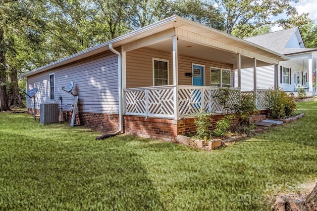 exterior space with central air condition unit and a front yard