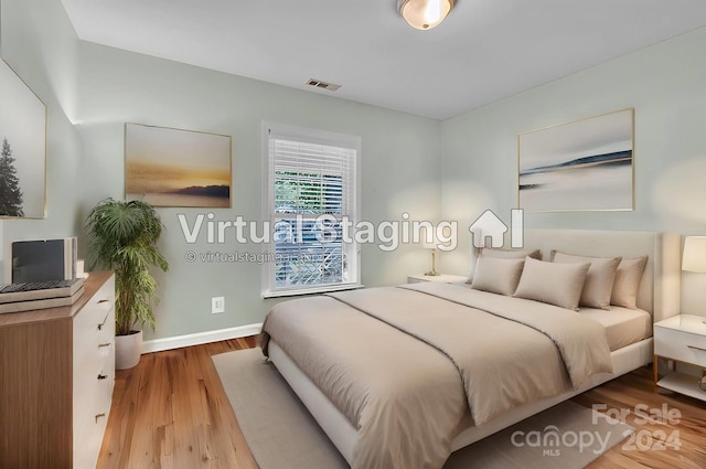 bedroom with light wood-type flooring