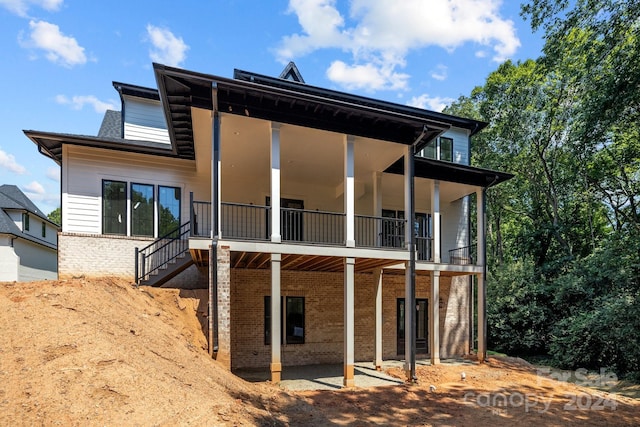 back of house with a balcony