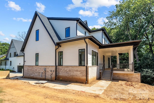 view of home's exterior featuring covered porch