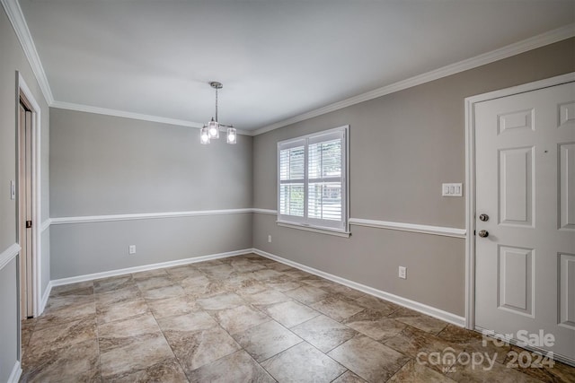 unfurnished room featuring crown molding and an inviting chandelier