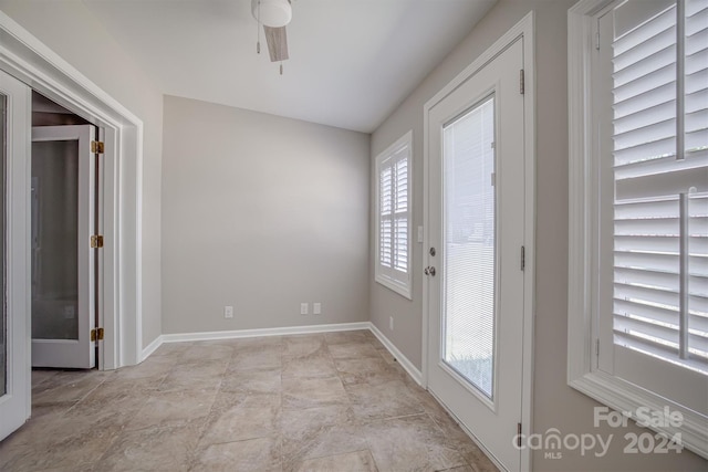 interior space featuring a wealth of natural light, french doors, and ceiling fan